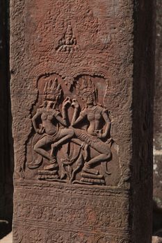 Angkor Watt, Cambodia is a temple complex with hundreds of temples decorated with sculptures, statues and wall reliefs. Many depict gods, kings and times of war. The are shot with side lighting giving texture and details to the subjects wall relief depicting ancient wars. High quality photo