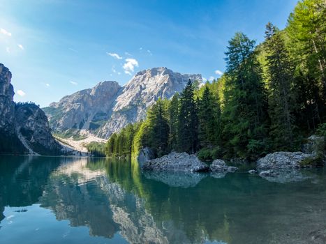 Hiking along the beautiful Braies lake in the Dolomites, South Tyrol