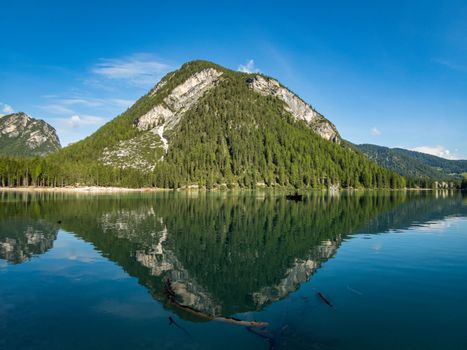 Hiking along the beautiful Braies lake in the Dolomites, South Tyrol