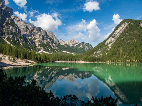 Hiking along the beautiful Braies lake in the Dolomites, South Tyrol