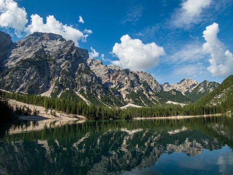 Hiking along the beautiful Braies lake in the Dolomites, South Tyrol