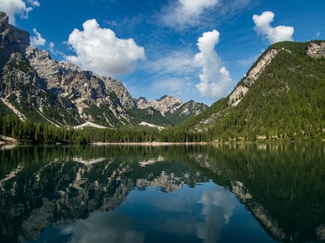 Hiking along the beautiful Braies lake in the Dolomites, South Tyrol