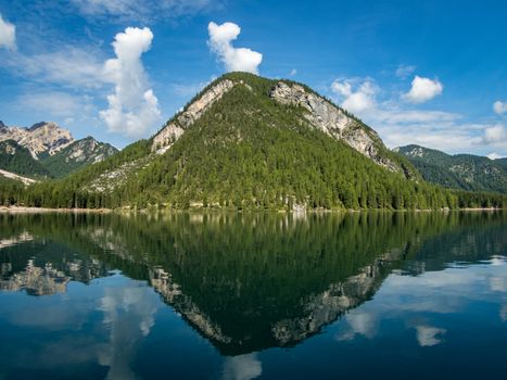 Hiking along the beautiful Braies lake in the Dolomites, South Tyrol