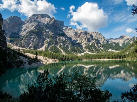 Hiking along the beautiful Braies lake in the Dolomites, South Tyrol