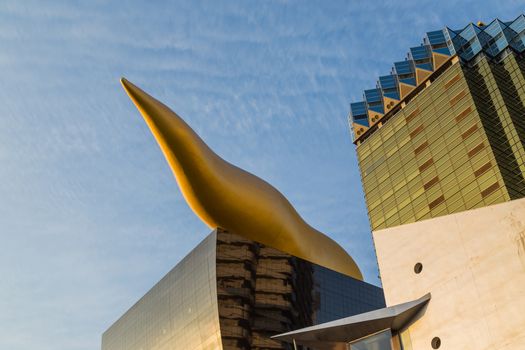 Tokyo. Japan: Asahi Beer buildings. Sunny day. Blue sky. Asahi Breweries headquarters building with the Asahi Flame