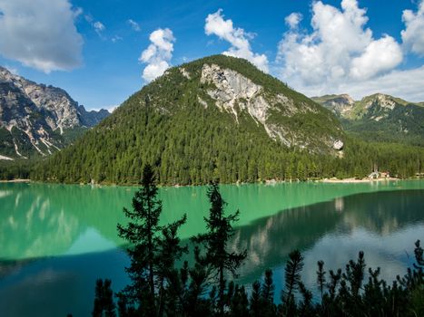 Hiking along the beautiful Braies lake in the Dolomites, South Tyrol