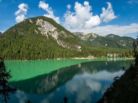 Hiking along the beautiful Braies lake in the Dolomites, South Tyrol