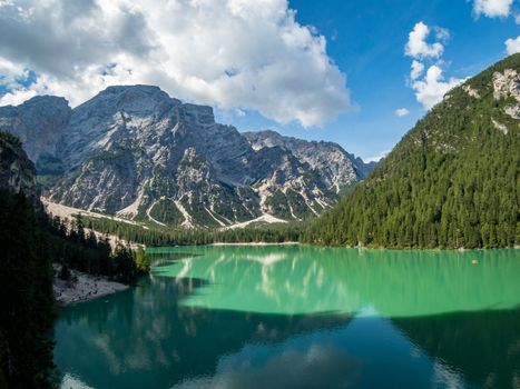 Hiking along the beautiful Braies lake in the Dolomites, South Tyrol