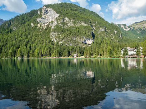 Hiking along the beautiful Braies lake in the Dolomites, South Tyrol