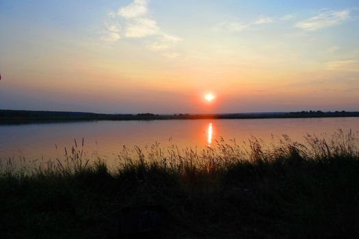 beautiful sunset over the lake and forest