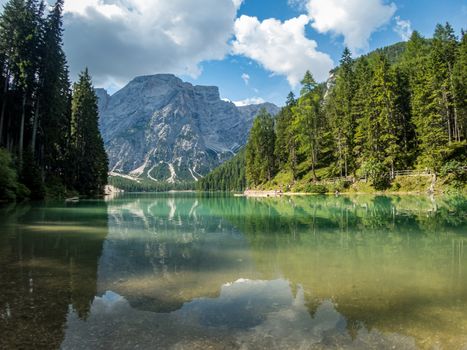 Hiking along the beautiful Braies lake in the Dolomites, South Tyrol