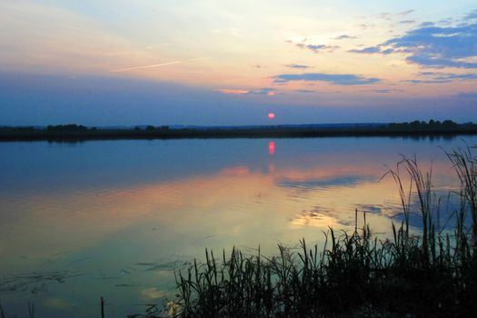 beautiful sunset over the lake and forest