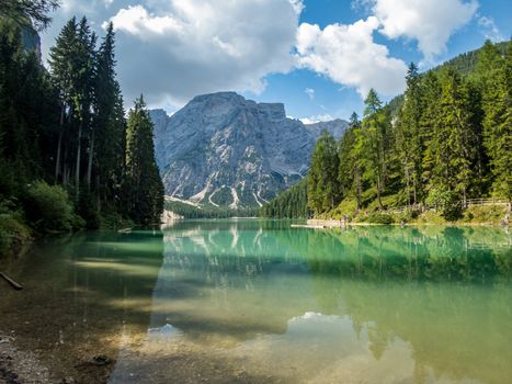 Hiking along the beautiful Braies lake in the Dolomites, South Tyrol