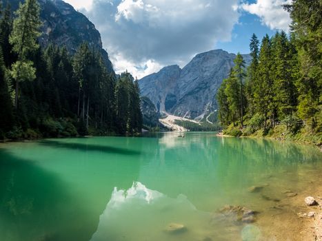 Hiking along the beautiful Braies lake in the Dolomites, South Tyrol