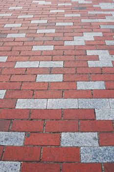 red and gray paving slabs in perspective