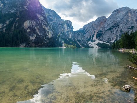 Hiking along the beautiful Braies lake in the Dolomites, South Tyrol