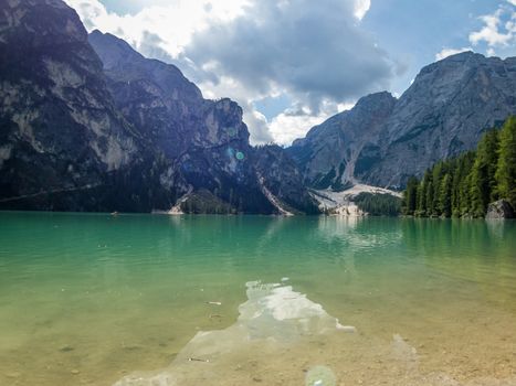 Hiking along the beautiful Braies lake in the Dolomites, South Tyrol