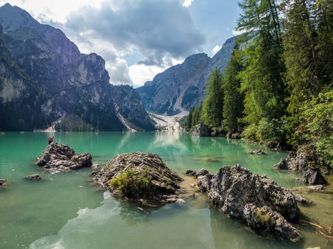 Hiking along the beautiful Braies lake in the Dolomites, South Tyrol