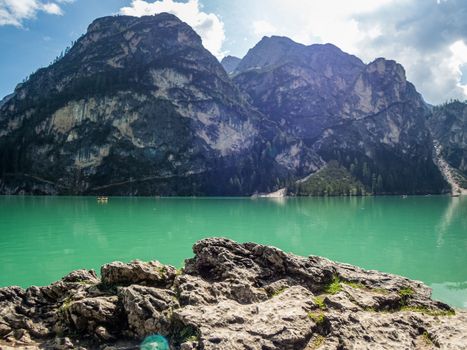 Hiking along the beautiful Braies lake in the Dolomites, South Tyrol