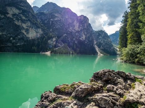 Hiking along the beautiful Braies lake in the Dolomites, South Tyrol