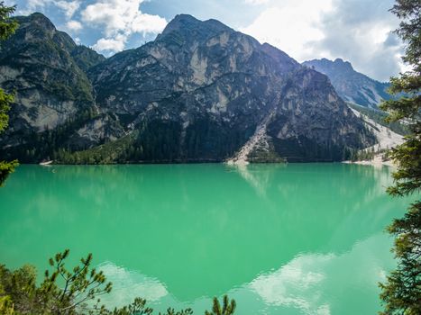 Hiking along the beautiful Braies lake in the Dolomites, South Tyrol