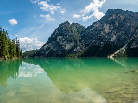 Hiking along the beautiful Braies lake in the Dolomites, South Tyrol