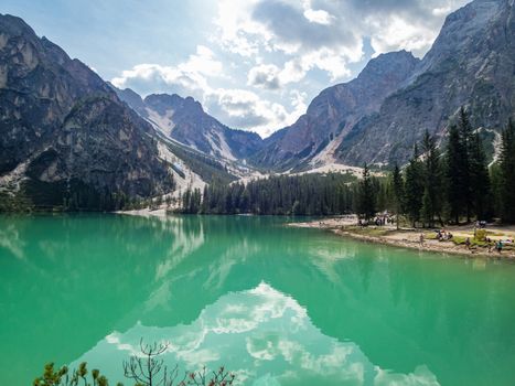 Hiking along the beautiful Braies lake in the Dolomites, South Tyrol