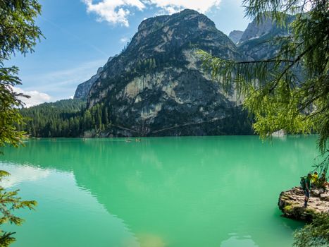 Hiking along the beautiful Braies lake in the Dolomites, South Tyrol