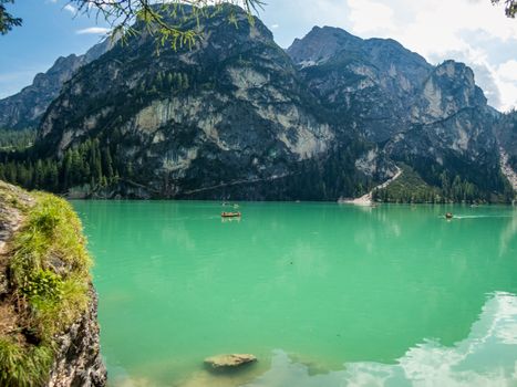 Hiking along the beautiful Braies lake in the Dolomites, South Tyrol
