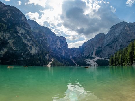 Hiking along the beautiful Braies lake in the Dolomites, South Tyrol