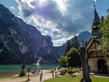 Hiking along the beautiful Braies lake in the Dolomites, South Tyrol