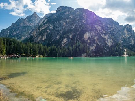 Hiking along the beautiful Braies lake in the Dolomites, South Tyrol