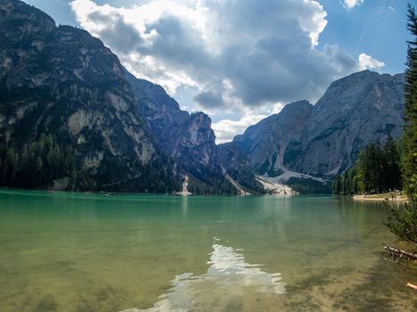 Hiking along the beautiful Braies lake in the Dolomites, South Tyrol