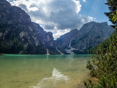 Hiking along the beautiful Braies lake in the Dolomites, South Tyrol