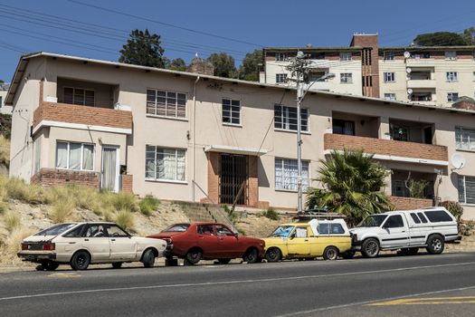 Living in Homes in Cape Town, South Africa. Cars, apartment blocks and city life.