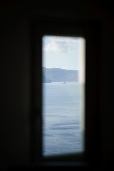 Scenic view from window indoor Santorini, Greece islands.