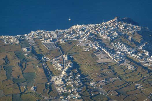 Aerial view of village on Santorini island, Greece from airplane.