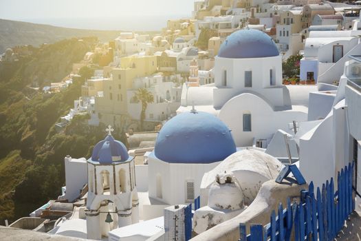 Famous three blue domes in Oia village, Santorini, Greece.