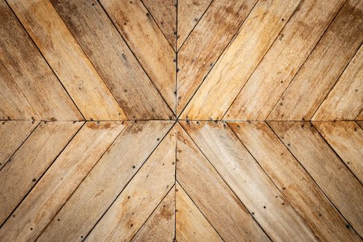 seamless brown color lumber in arrows or chevron pattern to the center. top view