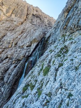 Climbing on the Pisciadu via ferrata of the Sella group in the Dolomites, South Tyrol