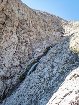 Climbing on the Pisciadu via ferrata of the Sella group in the Dolomites, South Tyrol