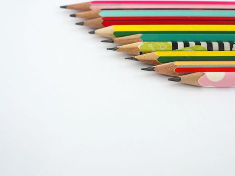 A pencil arranged in a row on a white background.