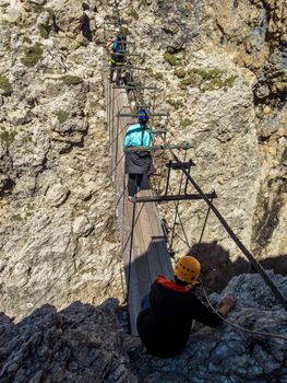 Climbing on the Pisciadu via ferrata of the Sella group in the Dolomites, South Tyrol