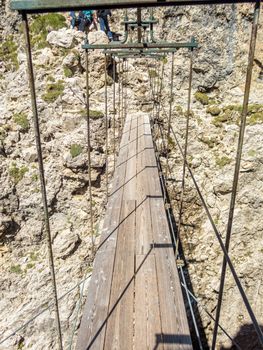 Climbing on the Pisciadu via ferrata of the Sella group in the Dolomites, South Tyrol