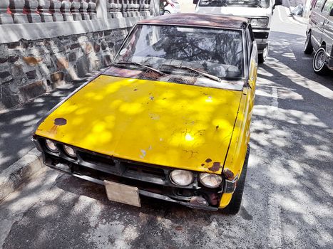 Old dirty rusted car, Bo-Kaap district, Cape Town, South Africa.