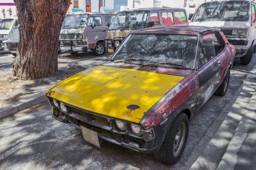 Old dirty rusted car, Bo-Kaap district, Cape Town, South Africa.