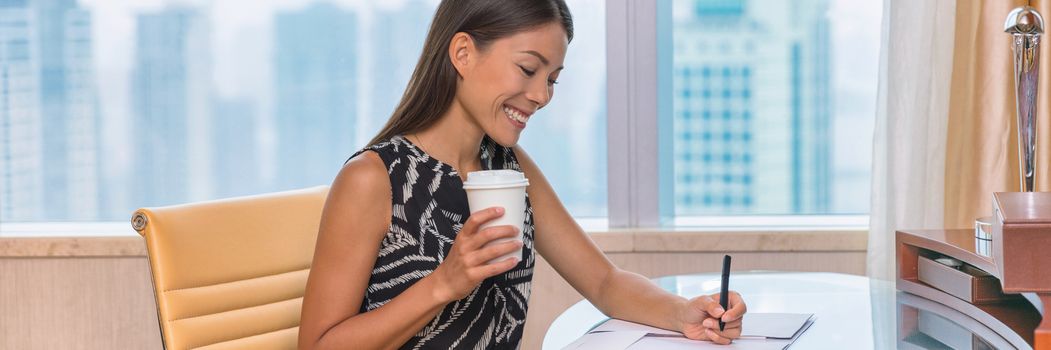 Businesswoman lawyer signing contract documents writing on desk. Business woman working on paperwork. Real estate agent or accountant drinking coffee doing work at hotel conference room office.