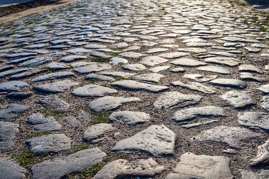 Granite cobblestones of a country road in Poland