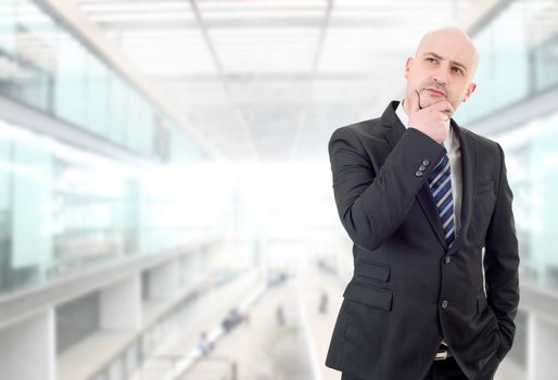 young business man thinking, at the office