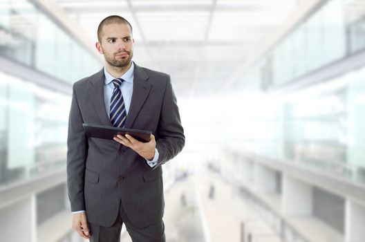 businessman bored with a tablet pc, at the office